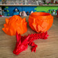 3D Printed Crystal Dragons Egg (Orange) and Tadling (tadpole dragon, Red)