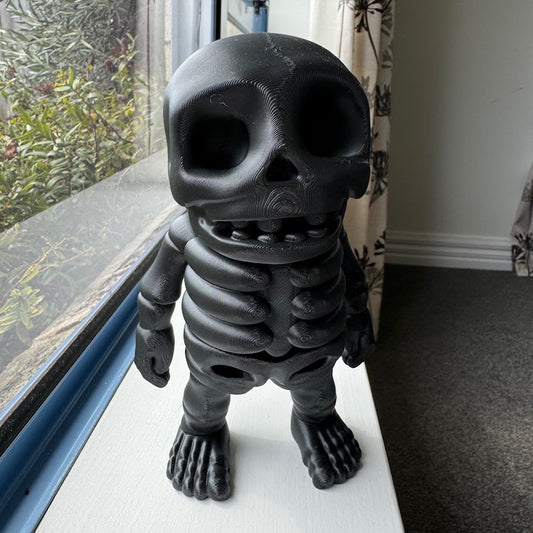 3D Printed Mini Flexi Skeleton upscaled 300% Carbon